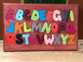 Alphabet puzzle. 11” X 18”.  Letters are 1/2 inch thick.   Wood type. Select pine, poplar and oak