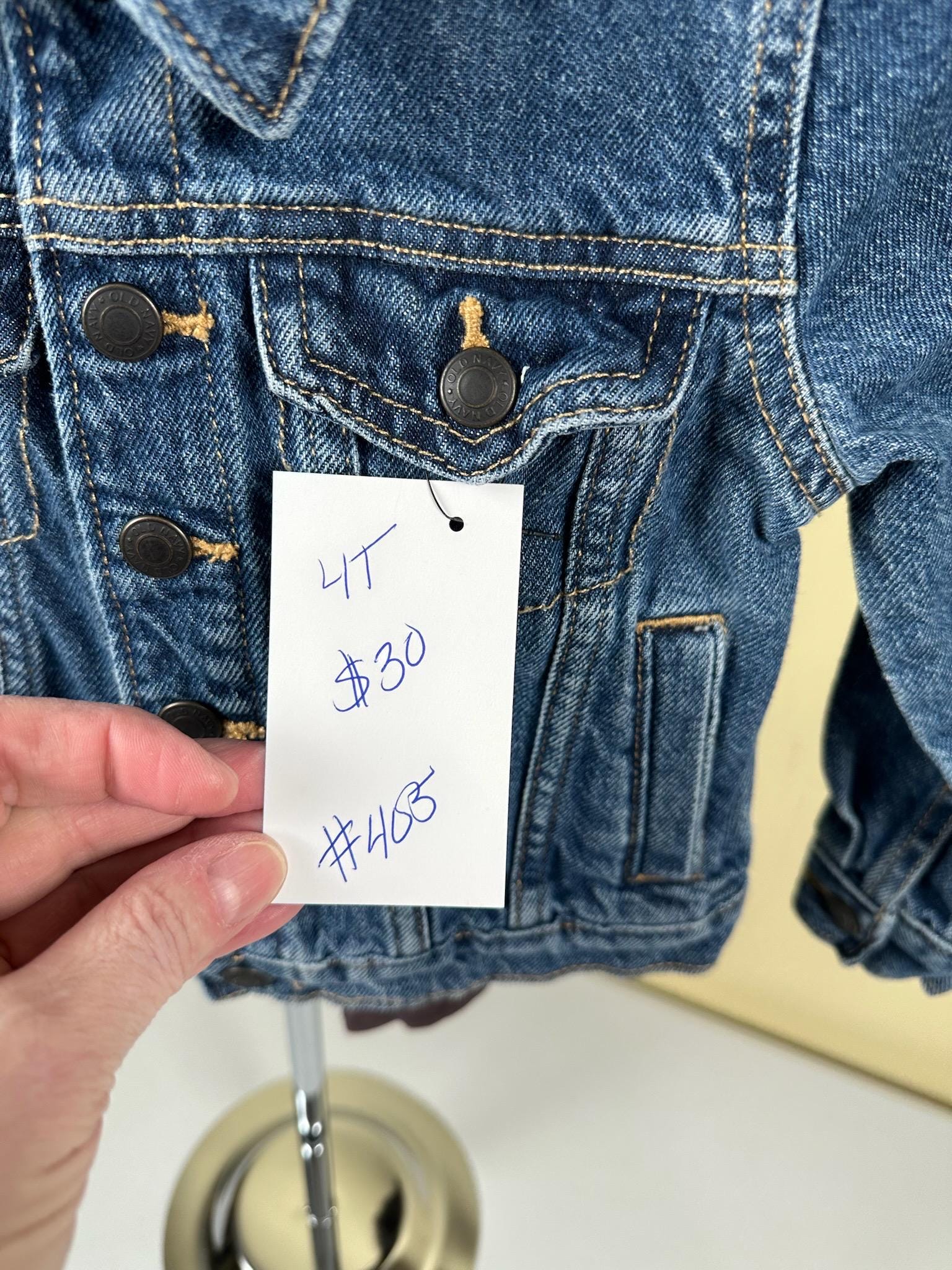 Denim jacket with Green heart on back. 4T size.