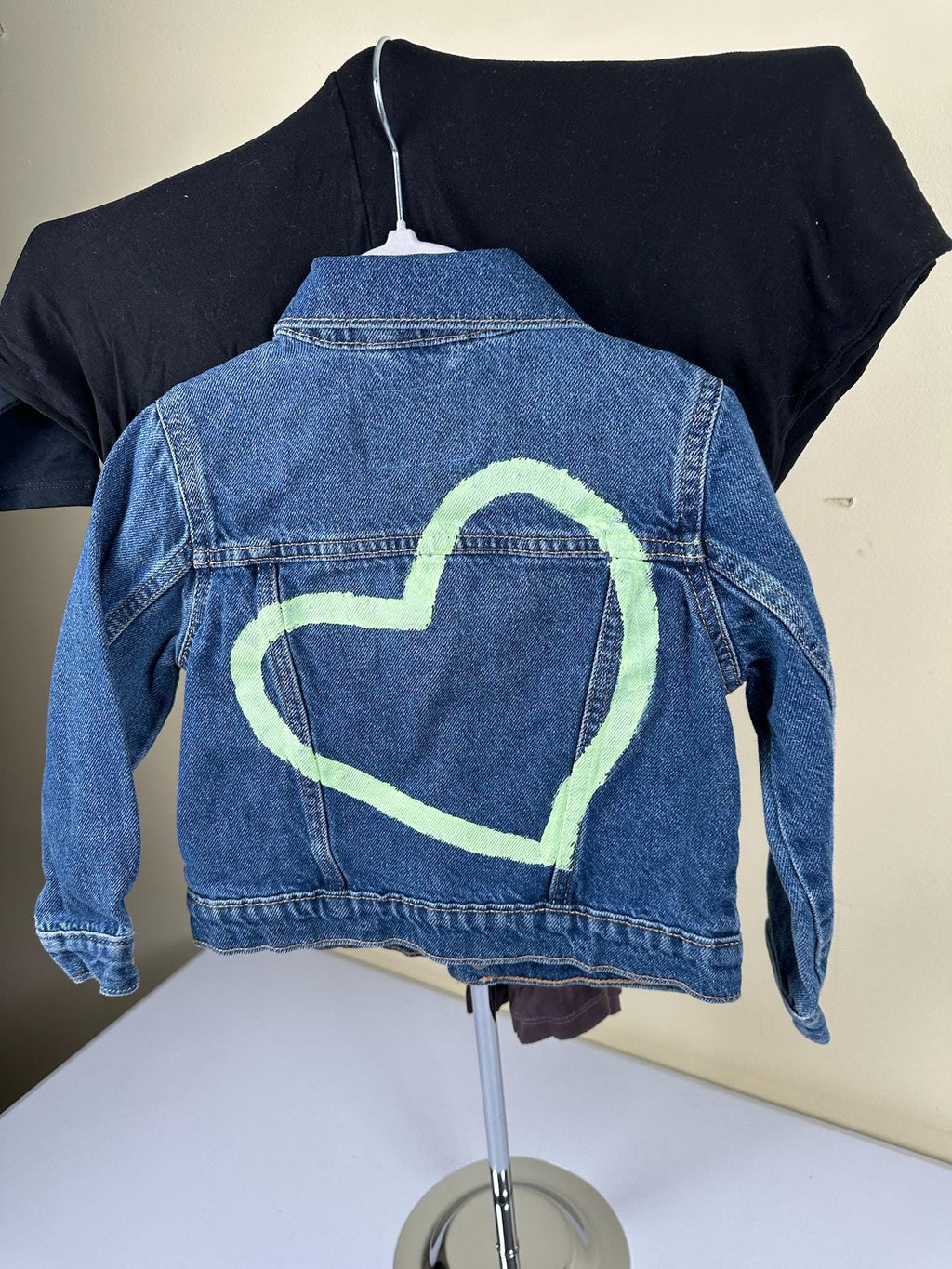 Denim jacket with Green heart on back. 4T size.
