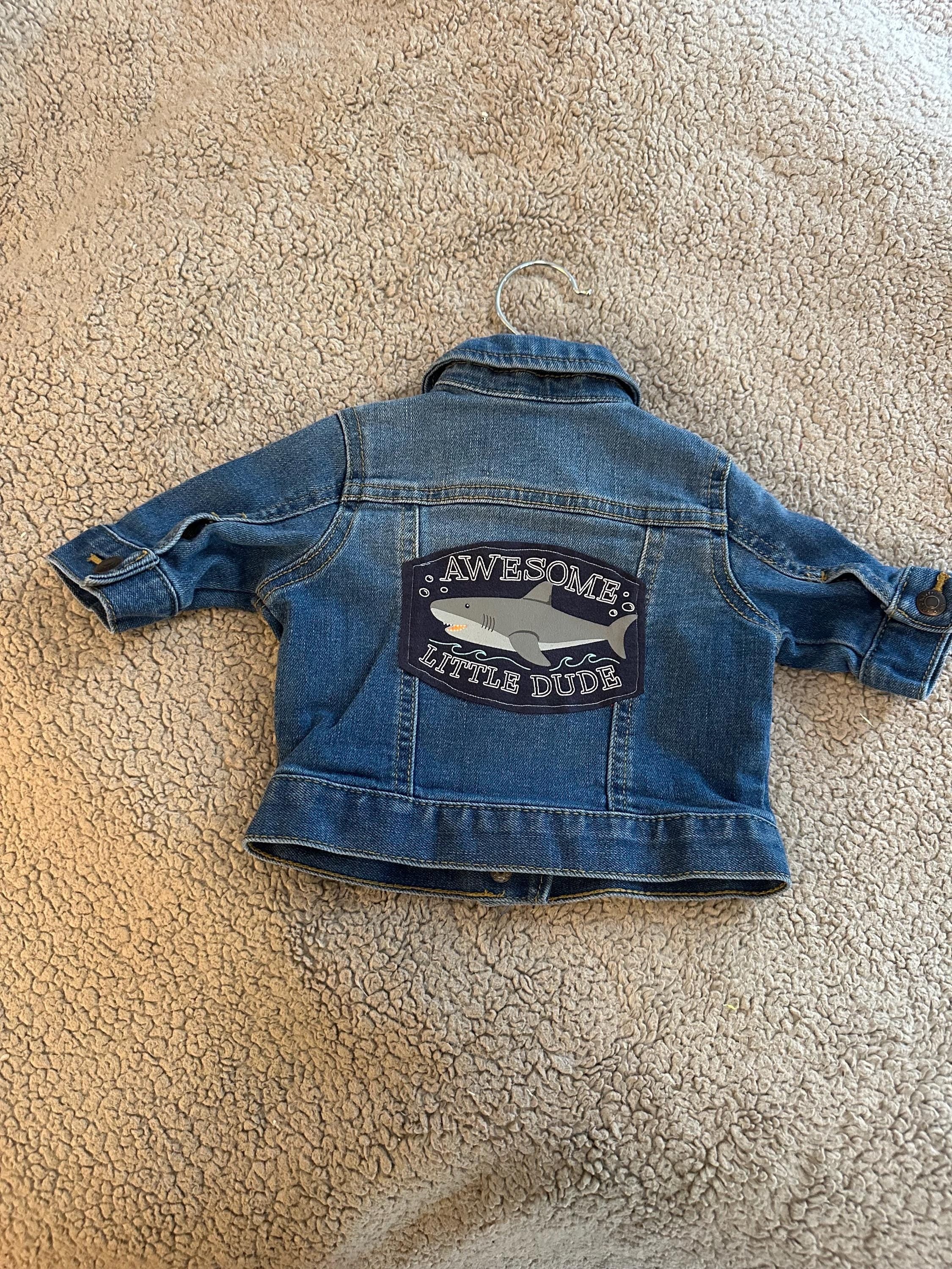 Denim jacket with awesome little dude shark on the back