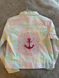 Pink anchor on tie dye denim jacket