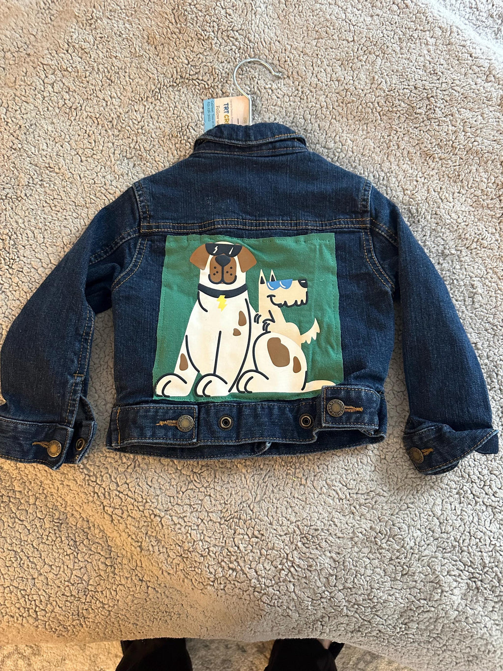 Denim jacket with dogs on the back