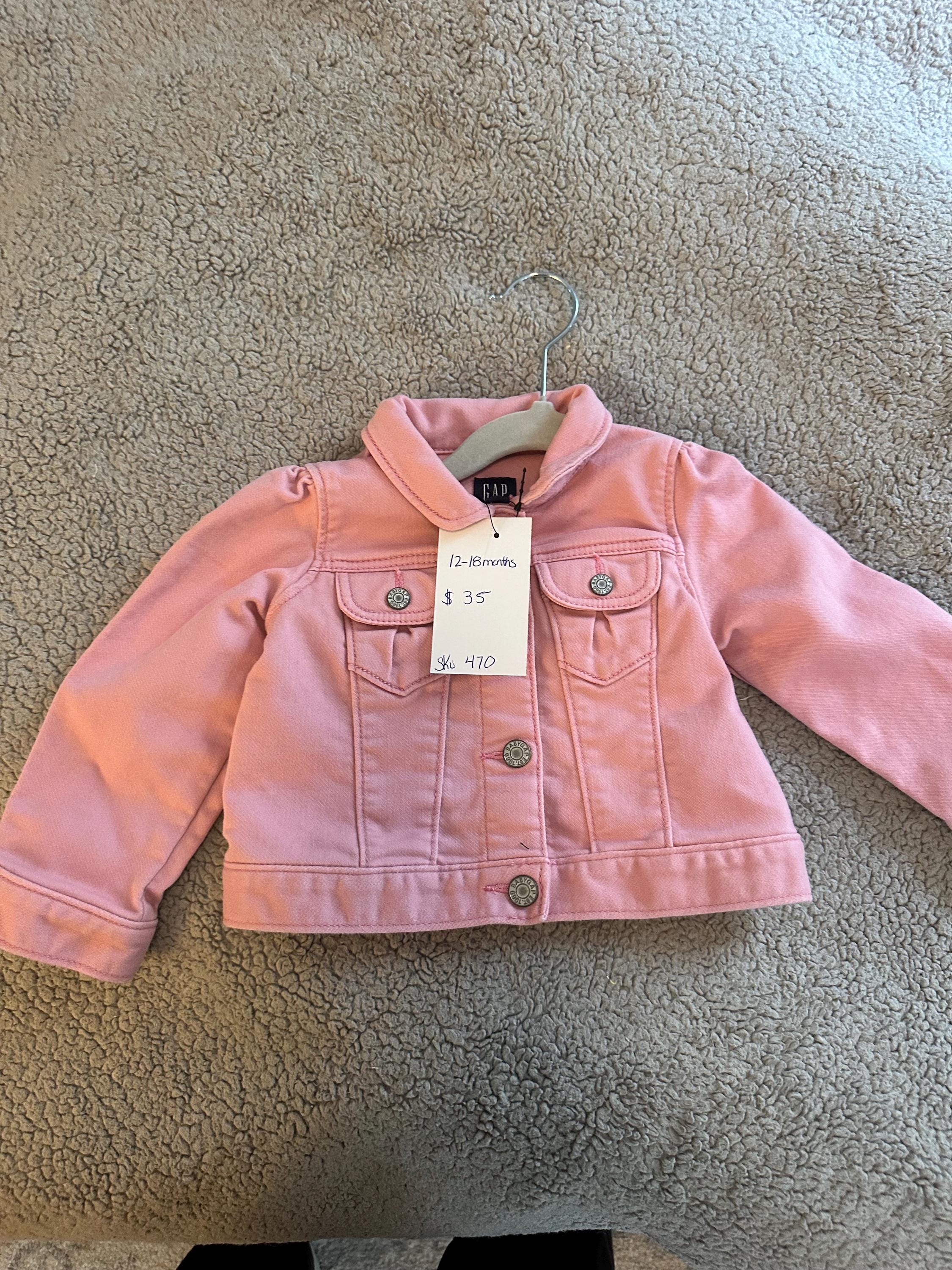 Pink denim jacket with pink butterflies on the back