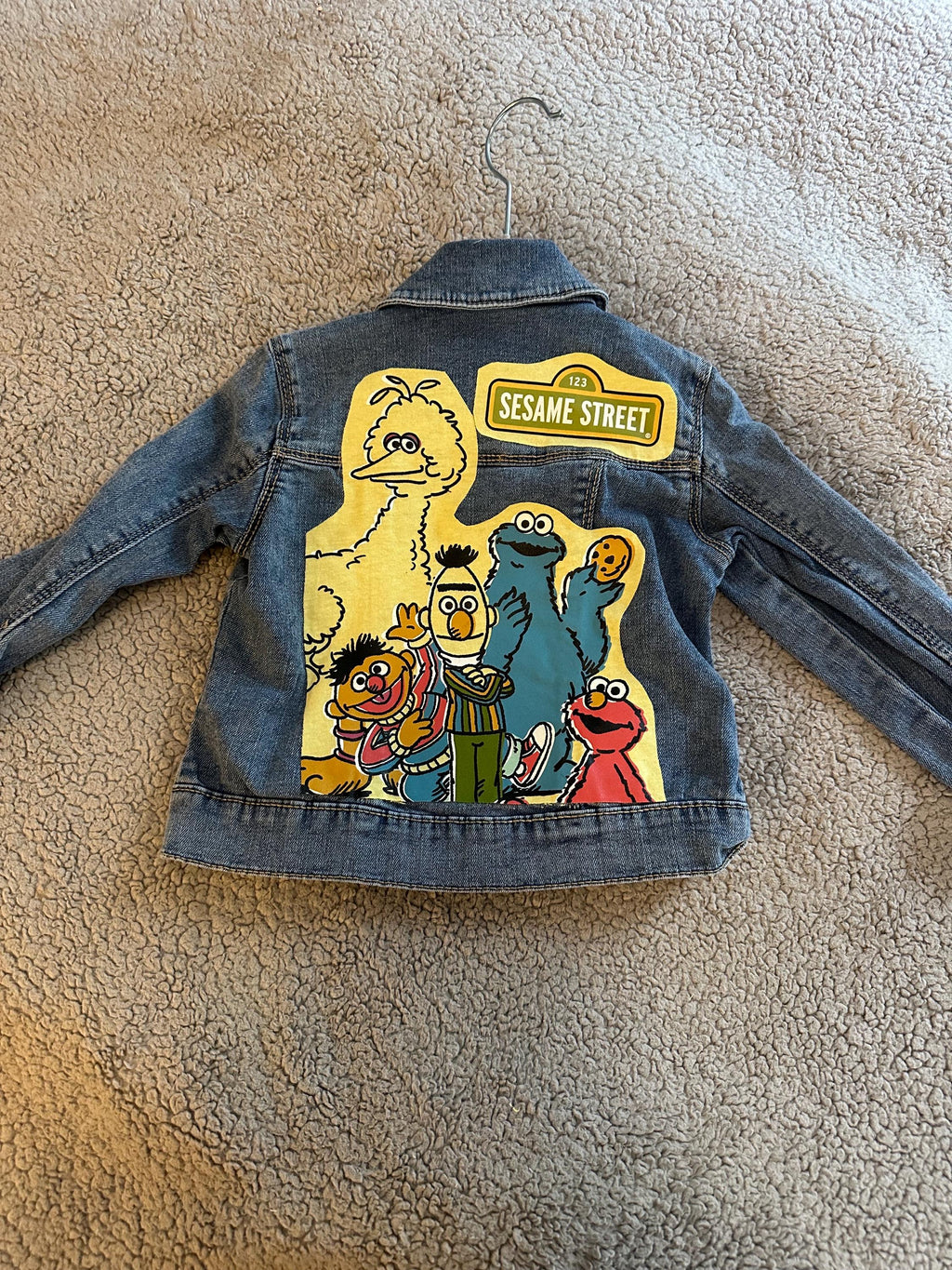 Denim jacket with Sesame Street on the back
