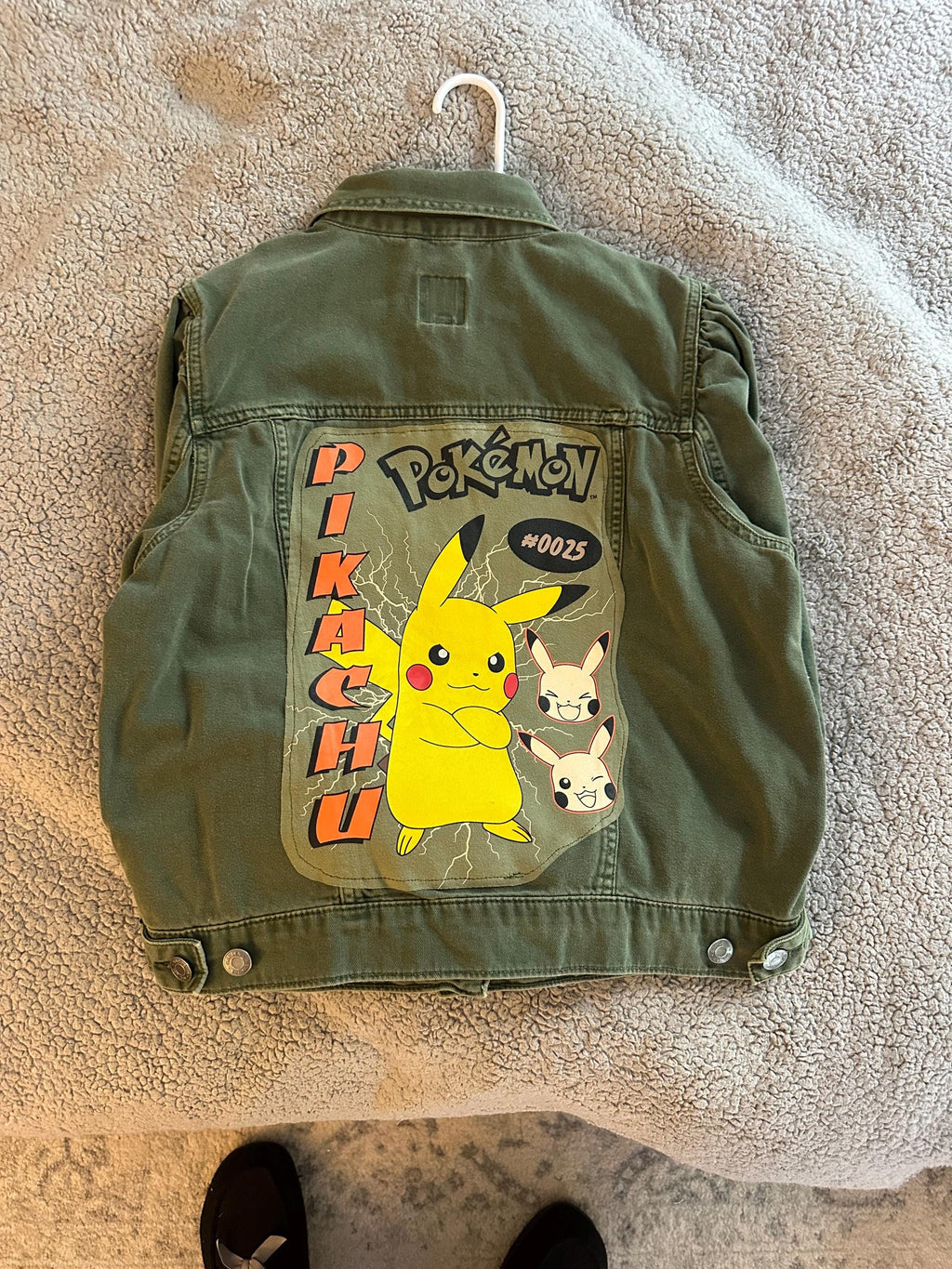 Green denim with Pokémon on the back
